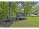 Fun backyard with playground and trampoline offers ample space for recreation and play at 306 N Meade Dr, Peachtree City, GA 30269
