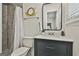 Well-lit bathroom features a vanity and shower with a modern design at 306 N Meade Dr, Peachtree City, GA 30269