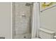 The bathroom features a tiled shower, updated fixtures, and stylish design at 306 N Meade Dr, Peachtree City, GA 30269