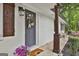 Charming front entrance featuring a decorative wreath, potted plants, and a welcome mat at 306 N Meade Dr, Peachtree City, GA 30269
