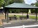 Sheltered picnic area with tables and grill, perfect for outdoor gatherings in a park at 306 N Meade Dr, Peachtree City, GA 30269