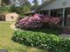 Landscaped front yard features a winding walkway and colorful azalea bushes at 1753 Brenda Dr, Jonesboro, GA 30236