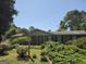 Brick home with mature landscaping and a well-maintained front yard at 1753 Brenda Dr, Jonesboro, GA 30236