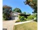 Exterior view of the garage with a gray door and a landscaped yard at 1753 Brenda Dr, Jonesboro, GA 30236