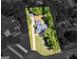 Aerial view of property lines highlighting the home, expansive yard, and surrounding greenery at 1302 Eddie Craig Ct, Mcdonough, GA 30252