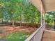 Beautiful back porch view of a private, fenced backyard with mature trees at 1302 Eddie Craig Ct, Mcdonough, GA 30252