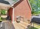 Spacious backyard featuring a wooden deck, grilling area, and lush greenery at 1302 Eddie Craig Ct, Mcdonough, GA 30252