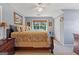 Charming bedroom with natural light, decorative art and accents and a comfortable queen sized bed at 1302 Eddie Craig Ct, Mcdonough, GA 30252