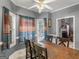 Dining area with ceiling fan, natural light, and easy access to living room at 1302 Eddie Craig Ct, Mcdonough, GA 30252
