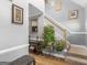 Inviting foyer featuring a staircase with wooden banister, stylish decor, and hardwood flooring at 1302 Eddie Craig Ct, Mcdonough, GA 30252