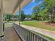 Charming front porch view showcasing the landscaped yard and neighborly surroundings, perfect for relaxing at 1302 Eddie Craig Ct, Mcdonough, GA 30252