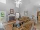 Cozy living room featuring a fireplace, neutral tones, and comfortable seating arrangement at 1302 Eddie Craig Ct, Mcdonough, GA 30252