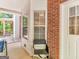 Inviting porch with white columns, brick accents, and space for outdoor seating at 1302 Eddie Craig Ct, Mcdonough, GA 30252