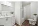 Well-lit bathroom featuring a vanity, toilet, and shower-tub combo with modern finishes at 4282 Worth Nw St, Acworth, GA 30101