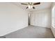 Neutral bedroom featuring carpet, a ceiling fan, a double door closet and natural light from a window at 4282 Worth Nw St, Acworth, GA 30101