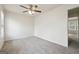 Bedroom featuring neutral walls, carpet, a ceiling fan, and an open doorway to the hallway at 4282 Worth Nw St, Acworth, GA 30101