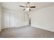 Bright bedroom featuring carpet, a ceiling fan, a double door closet and a doorway at 4282 Worth Nw St, Acworth, GA 30101
