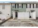 Townhome featuring a private patio, a black front door, and two parking spots at 4282 Worth Nw St, Acworth, GA 30101