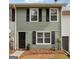 Charming two-story home with black shutters, a black front door, and a manicured lawn at 4282 Worth Nw St, Acworth, GA 30101