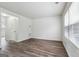 Spacious living room with new vinyl floors and ample natural light from a bright window at 4282 Worth Nw St, Acworth, GA 30101