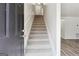 Bright entryway with a carpeted staircase leading upstairs and a modern, open feel at 4282 Worth Nw St, Acworth, GA 30101