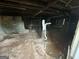 Unfinished basement with exposed piping, dirt floor, and raw foundation, needing extensive work at 305 Fairburn Nw Rd, Atlanta, GA 30331