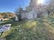 Exterior view of a dilapidated home with neglected yard needing major renovation at 305 Fairburn Nw Rd, Atlanta, GA 30331