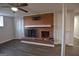 Finished basement with a brick fireplace, updated flooring, and a ceiling fan at 2647 Mount Carmel Rd, Hampton, GA 30228