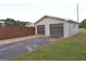 Detached two-car garage with a private driveway, offering ample parking and storage space for vehicles and equipment at 2647 Mount Carmel Rd, Hampton, GA 30228