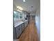 Renovated kitchen featuring stainless appliances, gray cabinets and quartz countertops at 2647 Mount Carmel Rd, Hampton, GA 30228