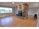 Living room with hardwood floors, fireplace, and ample natural light at 2647 Mount Carmel Rd, Hampton, GA 30228