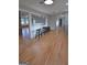 Open-concept living area with hardwood floors and bar seating at 2647 Mount Carmel Rd, Hampton, GA 30228