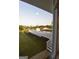 View of fenced pool area with white deck from inside the home at 2647 Mount Carmel Rd, Hampton, GA 30228
