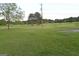 Expansive grassy yard, offering plenty of space for recreational activities or simply enjoying the outdoors in a serene setting at 2647 Mount Carmel Rd, Hampton, GA 30228