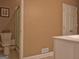 Simple bathroom with tile flooring, white vanity and shower and toilet at 187 Eagles Club Dr, Stockbridge, GA 30281