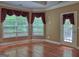 Bedroom with lots of windows, hardwood floors, and ensuite access at 187 Eagles Club Dr, Stockbridge, GA 30281