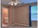 Cozy bedroom with carpet, natural light, and access to a private ensuite bathroom at 187 Eagles Club Dr, Stockbridge, GA 30281