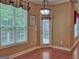 Cozy breakfast nook bathed in natural light, featuring wood floors and modern light fixture at 187 Eagles Club Dr, Stockbridge, GA 30281
