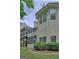 View of the rear exterior of a two story home, featuring a screened porch and second story deck at 187 Eagles Club Dr, Stockbridge, GA 30281