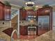 Well-equipped kitchen with stainless steel appliances and beautiful wooden cabinetry at 187 Eagles Club Dr, Stockbridge, GA 30281