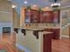 Eat in kitchen featuring granite counters, island, and stainless steel appliances at 187 Eagles Club Dr, Stockbridge, GA 30281