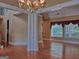 Bright and airy living area with hardwood floors, modern lighting, and large windows at 187 Eagles Club Dr, Stockbridge, GA 30281