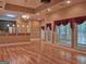Spacious living room boasts hardwood floors, natural light, and an adjacent kitchen bar at 187 Eagles Club Dr, Stockbridge, GA 30281