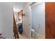 Bathroom featuring toilet and adjoining laundry area with vintage cabinets at 75 Antioch Rd, Mcdonough, GA 30252