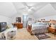 Bedroom with vaulted ceilings, carpeted floors, and traditional wooden furniture at 75 Antioch Rd, Mcdonough, GA 30252