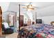 Bedroom featuring a decorative bed, a ceiling fan and a sitting area at 75 Antioch Rd, Mcdonough, GA 30252