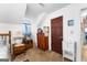 Bedroom featuring a bed, dresser, and decoratively draped window at 75 Antioch Rd, Mcdonough, GA 30252