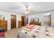 Bedroom featuring a ceiling fan, carpet, and a private ensuite bathroom at 75 Antioch Rd, Mcdonough, GA 30252