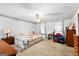 Bedroom featuring a ceiling fan, windows with curtains, and carpet at 75 Antioch Rd, Mcdonough, GA 30252