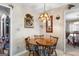 Cozy breakfast nook with a wooden table, four chairs, and hanging light fixture at 75 Antioch Rd, Mcdonough, GA 30252